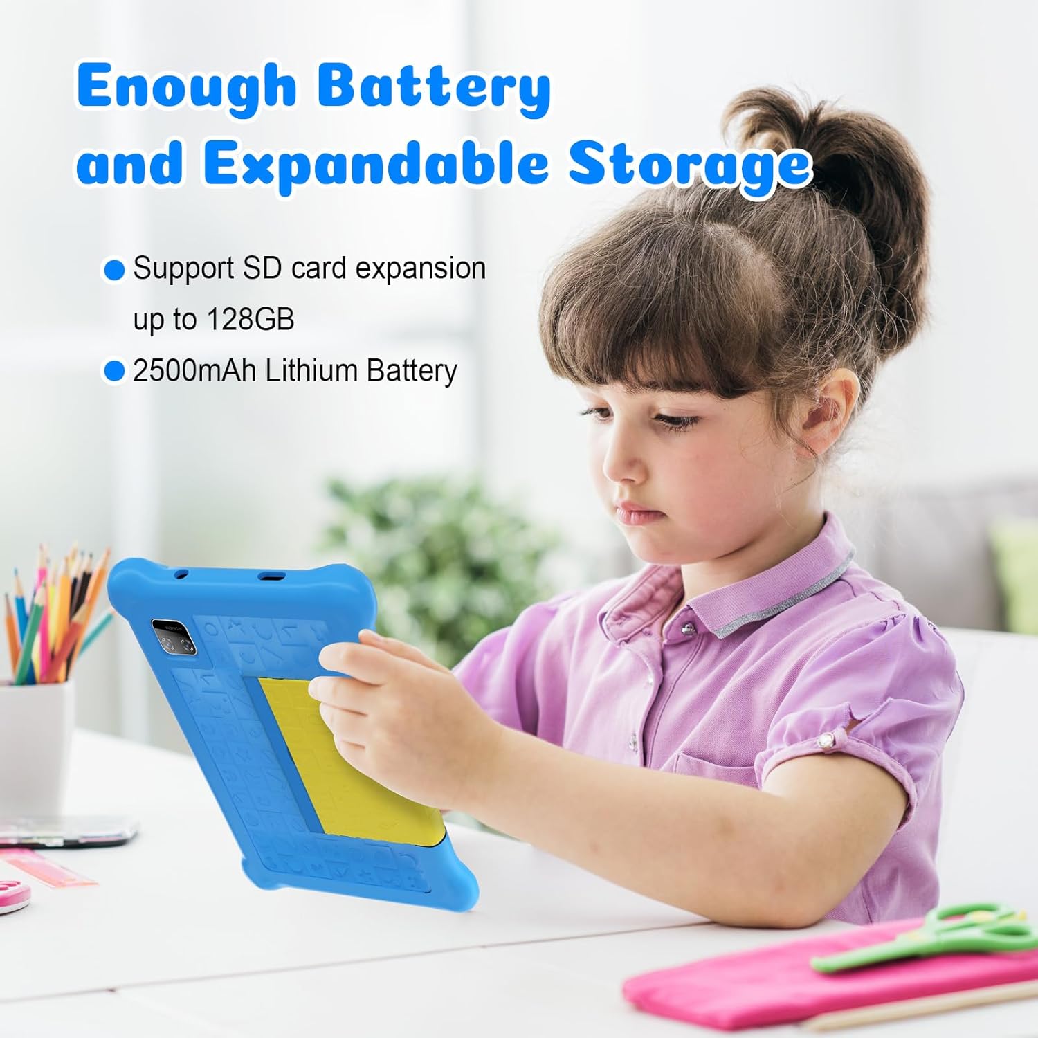 Blue kids tablet in shockproof case, child using it while seated at a desk