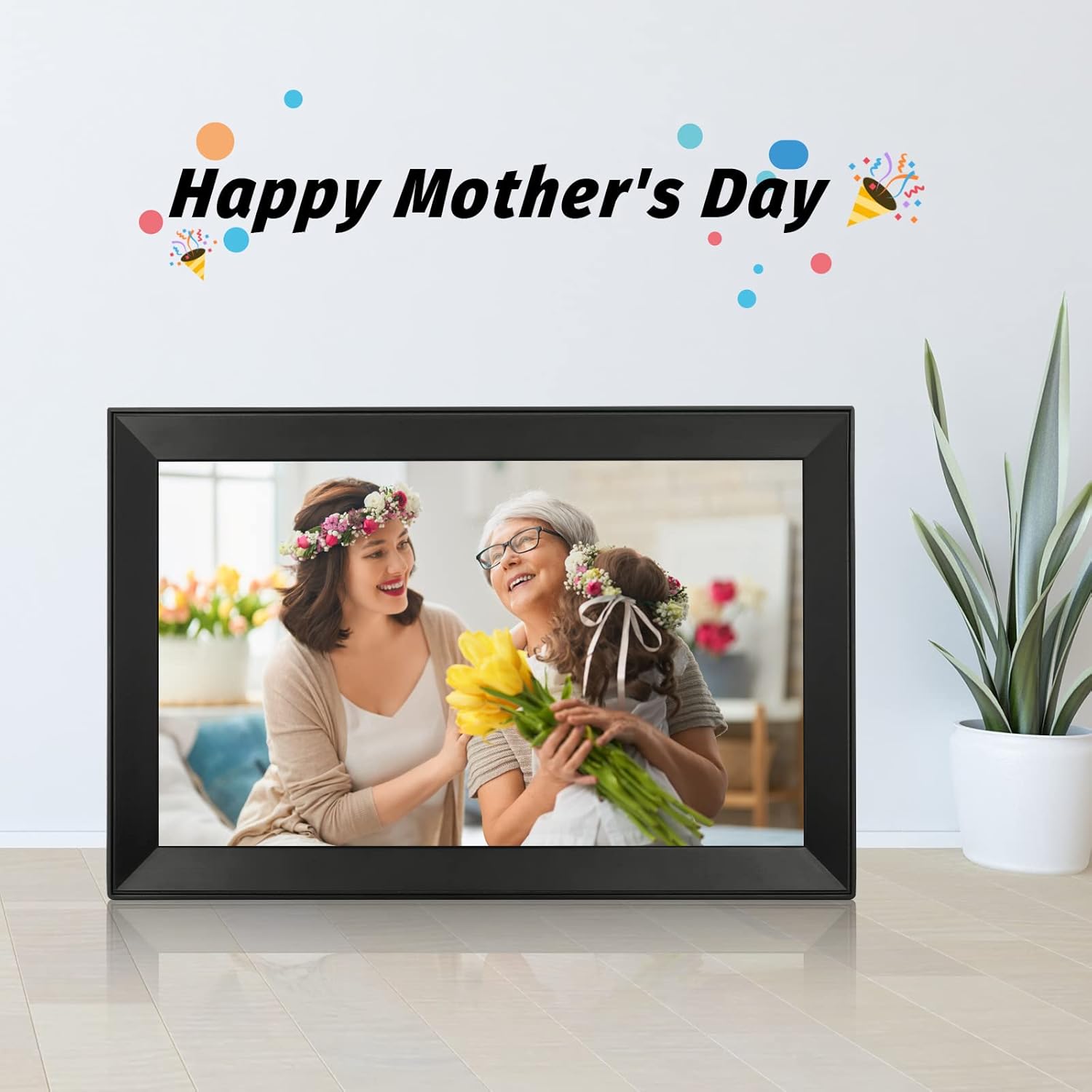Digital picture frame with touch screen, black frame showing two people holding flowers