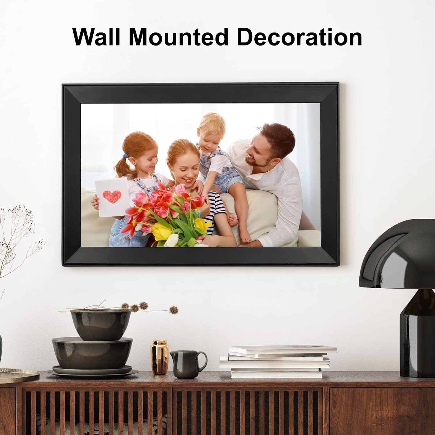 Digital picture frame with touch screen, black frame showing a family holding flowers
